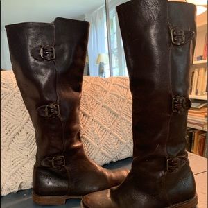 Brown Frye knee high boots.